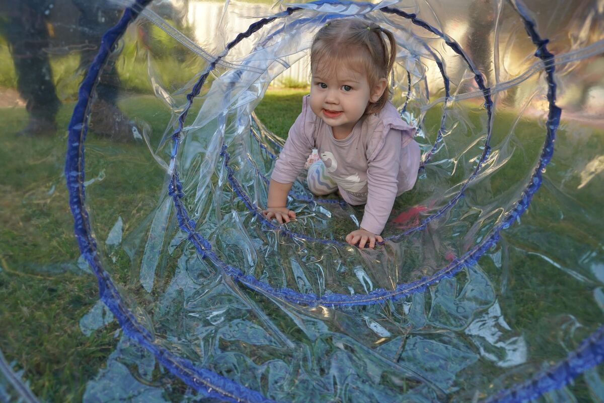 Children playing outdoors at Explorers School of Early Learning